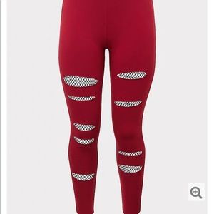 Slashed fishnet red leggings